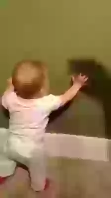 Funny Baby Playing With Shadow