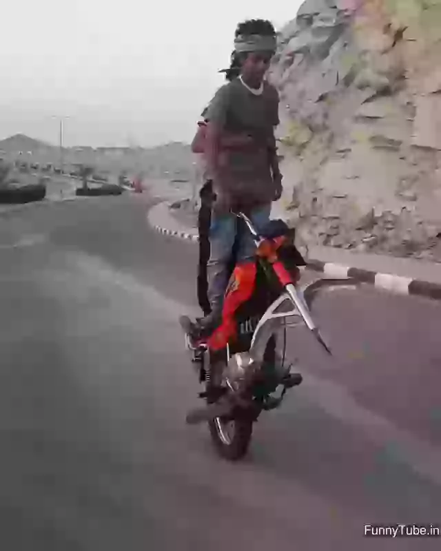 Two Boys On One Wheel Stunt